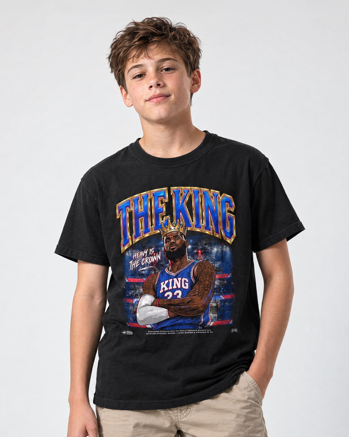 Model wearing a kids sized the king lebron james shirt by Philly Sports Shirts