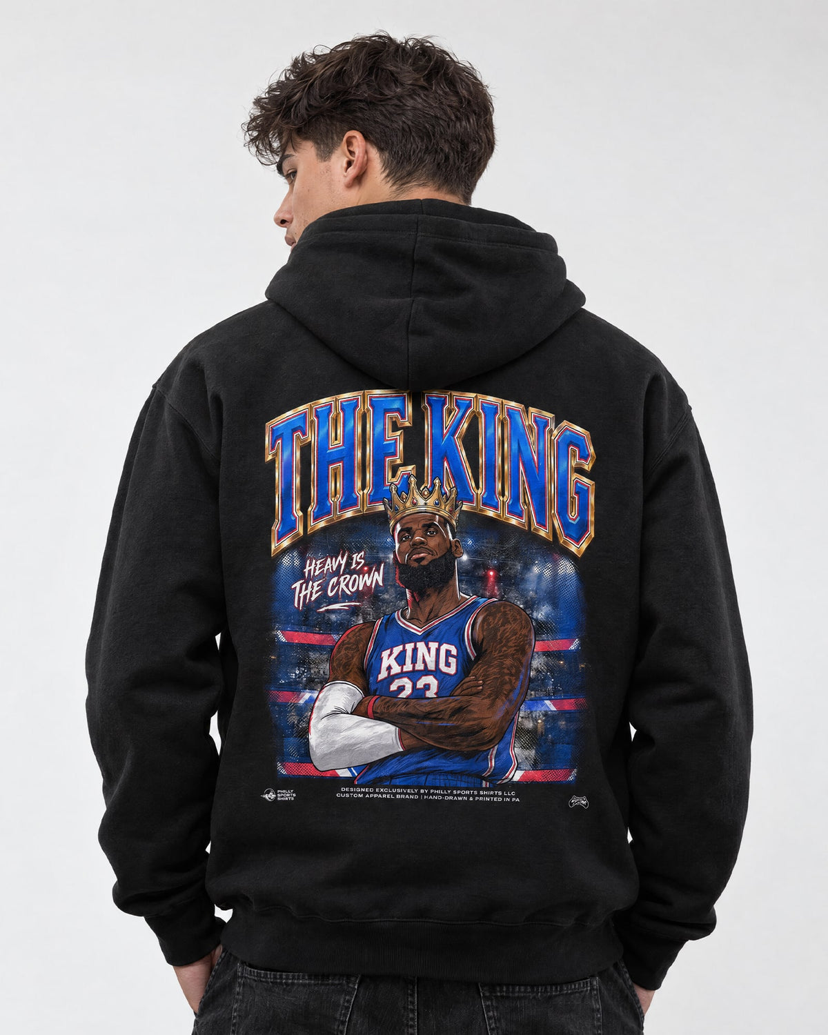 Male model wearing the king lebron james pullover the king lebron james hoodie by Philly Sports Shirts