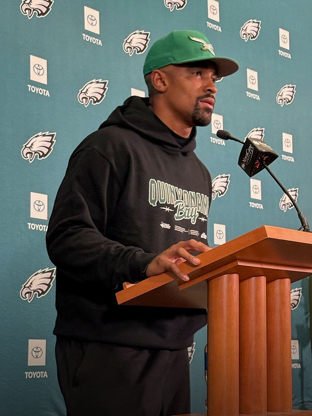 Eagles Quarterback Jalen Hurts wearing Philly Sports Shirts and Quinyon Mitchell Hoodie at presser