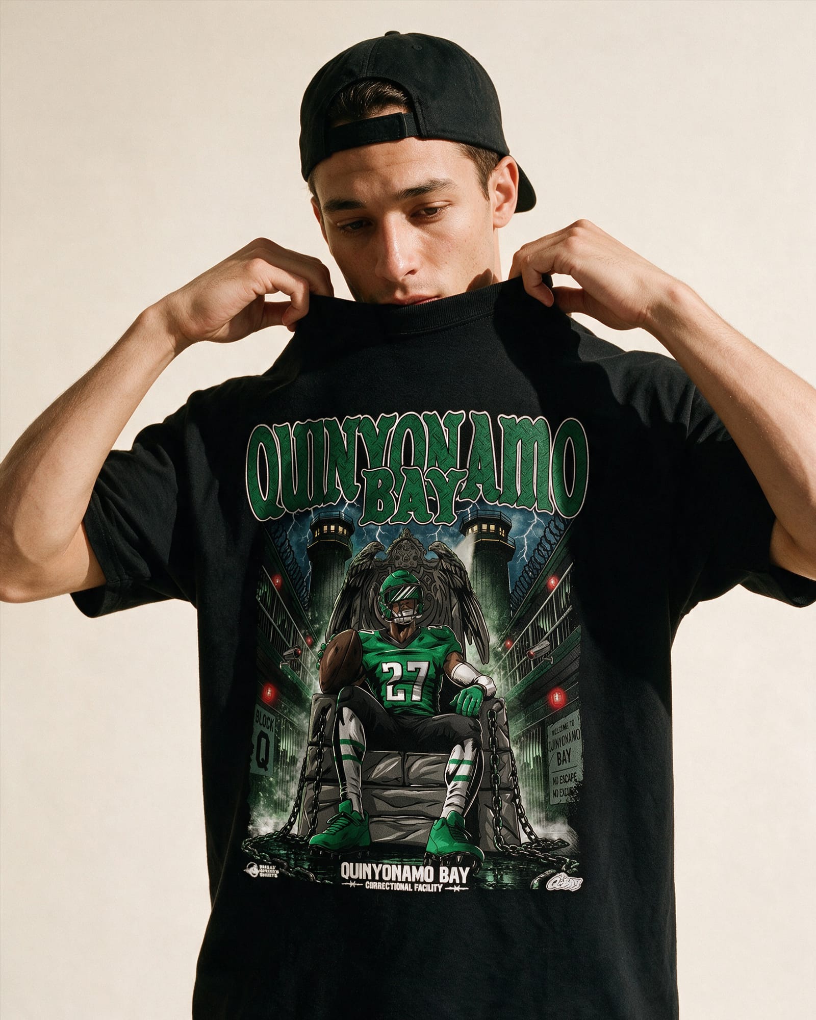 Model wearing a Quinyonamo Bay T\-shirt, a bold Quinyon Mitchell Eagles graphic tee designed for Philadelphia Eagles fans.