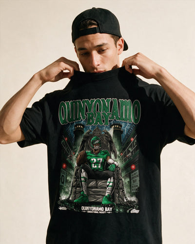 Model wearing a Quinyonamo Bay T\-shirt, a bold Quinyon Mitchell Eagles graphic tee designed for Philadelphia Eagles fans.