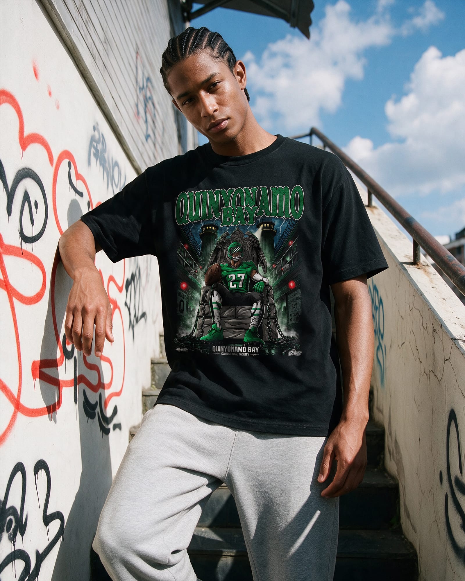 Model wearing a Quinyonamo Bay shirt featuring Quinyon Mitchell. Philadelphia Eagles football fan tshirt.